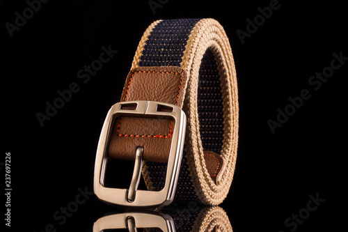 Fotografie Men's fashion belt isolated on black background