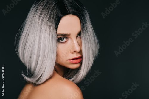beautiful sensual model posing in grey wig, isolated on black