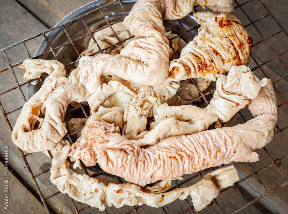 chitterlings pork entrails / grilled entrails intestines part of pork Stock Photo Adobe Stock