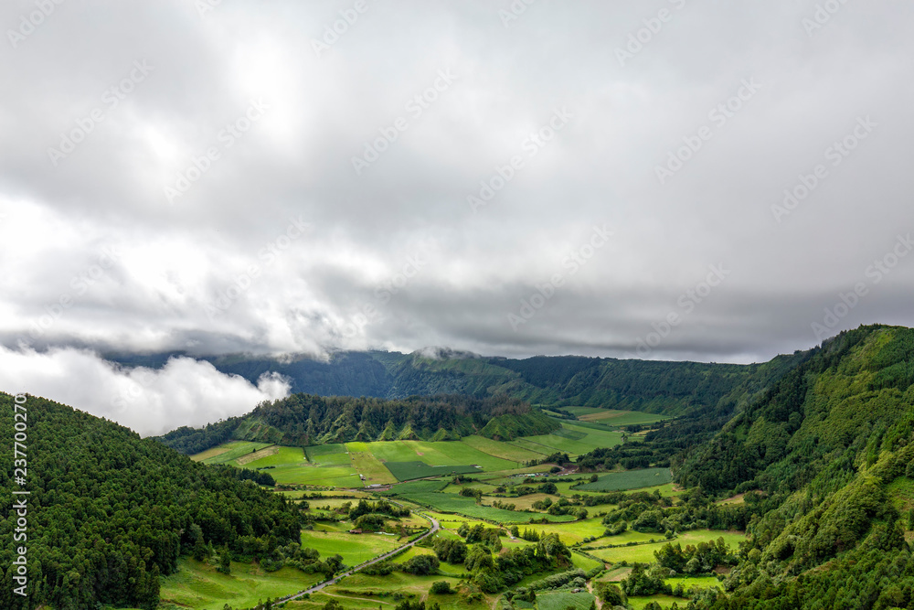 View of two small calderas inside a much larger one on the island of Sao Miguel in the Azores.