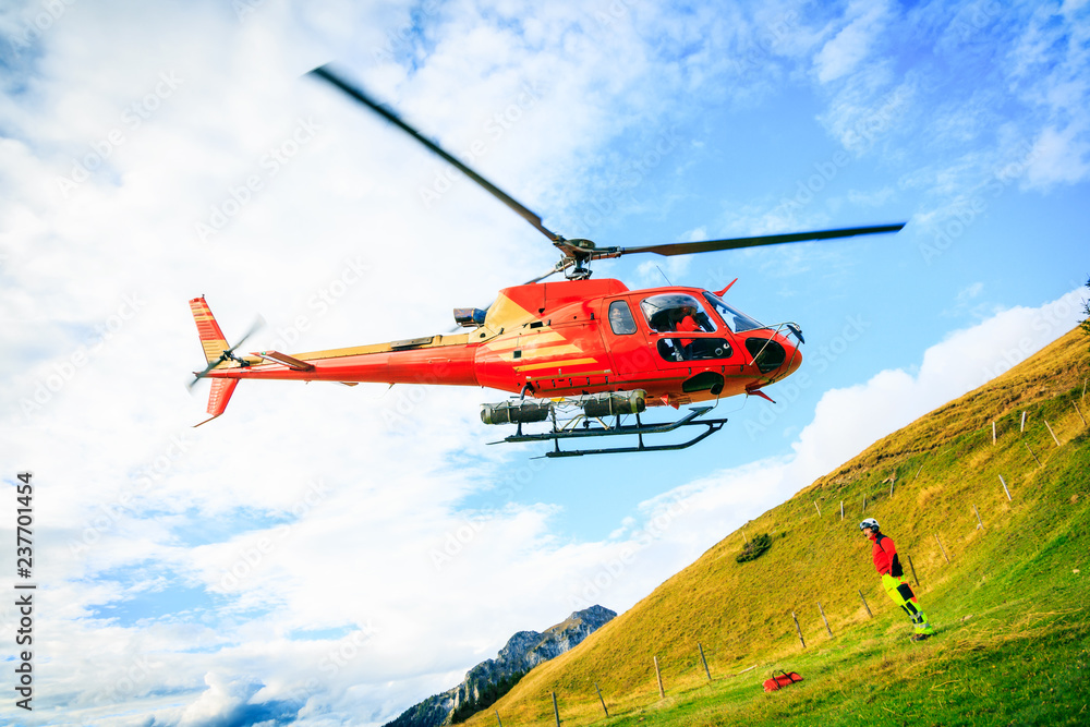 Fototapeta premium Red Helicopter In The Swiss Alps