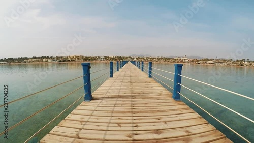 Wallpaper Mural Romantic sunny seaside resort landscape. Red sea, Egypt. Camera movement on the long pier. Rest and relaxation, outdoor recreation by the quiet calm sea, ocean. Slow motion Torontodigital.ca