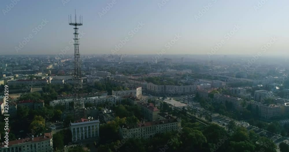 Summer morning in Minsk city. Aerial shot of the city center capital of Belarus, drone view of housing area, buildings, Victory square and traffic on central street Summer morning in Minsk city. Aerial shot of the city center capital of Belarus, drone view of housing area, buildings, Victory square and traffic on central street