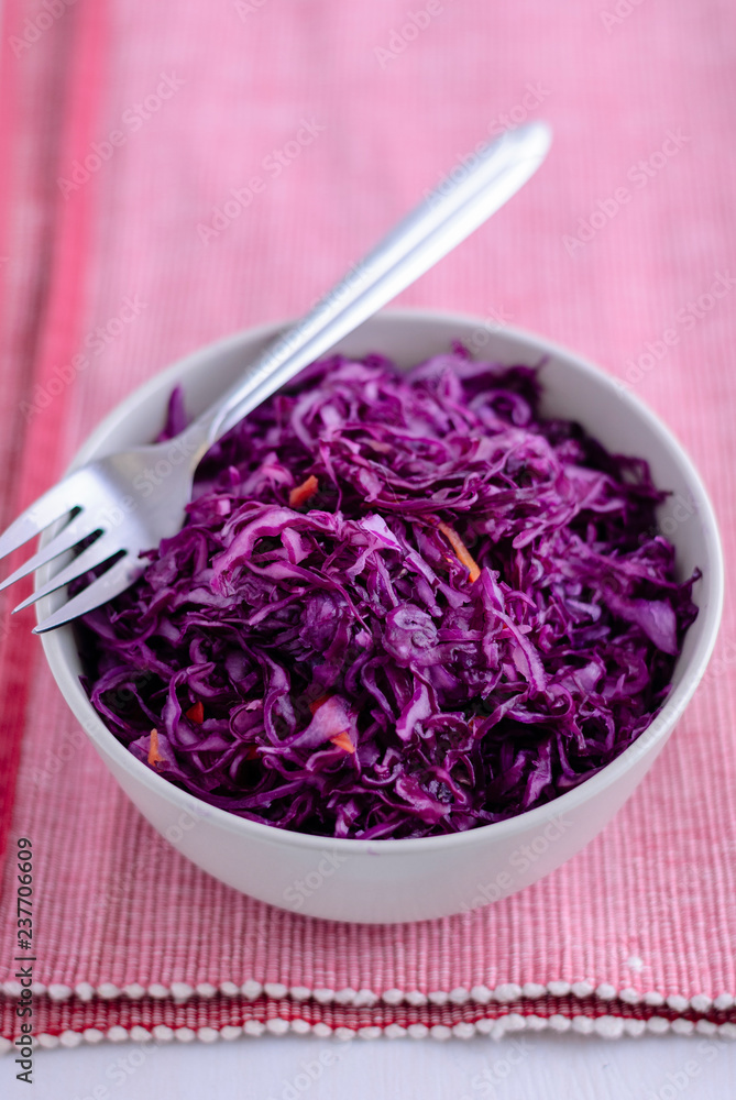 Fork on bowl with purple sauerkraut Fork on bowl with purple sauerkraut