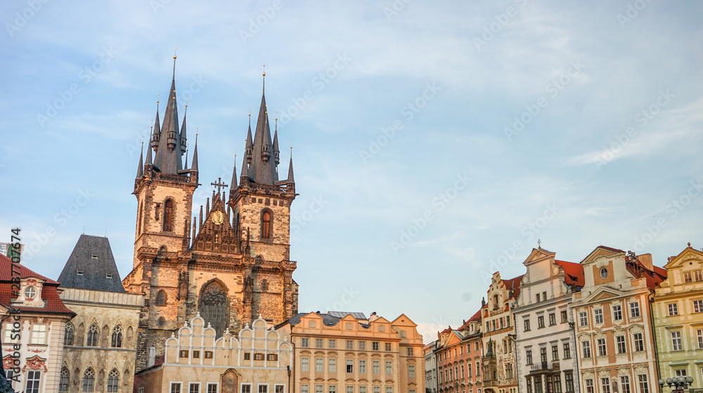 Old Town Square in Prague with magnificent town houses and church