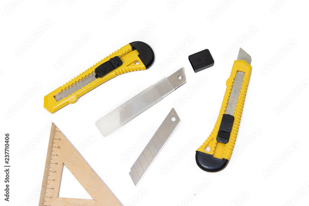 Construction knives on a white background Tools on a white background. Items for repair and collection of furniture. Construction knives on a white background Tools on a white background. Items for repair and collection of furniture.