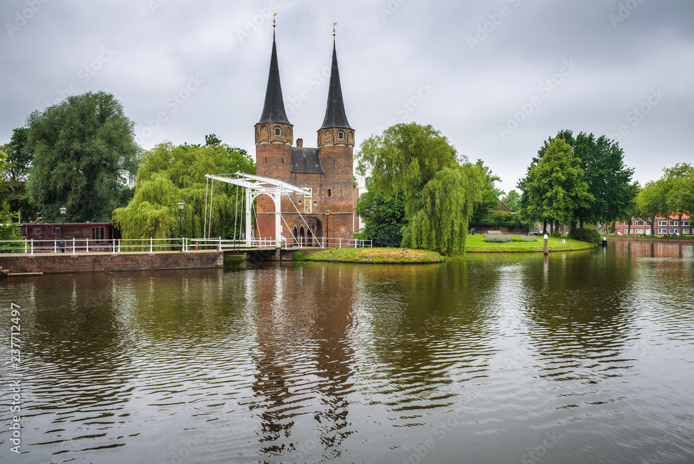 Eastern gate, canal and historic drawbridge in Delft, Netherland Eastern gate, canal and historic drawbridge in Delft, Netherland