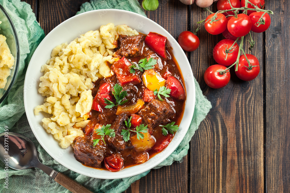 Hungarian beef goulash serwed with galuska noodles - obrazy, fototapety, plakaty 