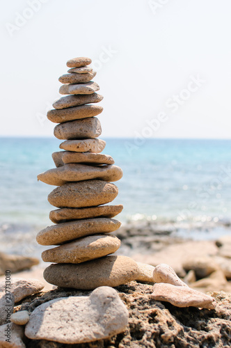 inspirational pile of stones, man made, well balanced and stacked seaside