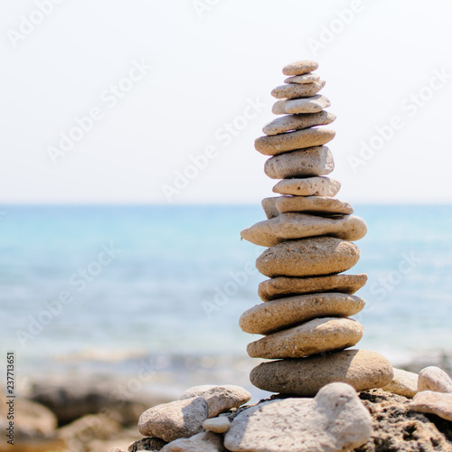 inspirational pile of stones, man made, well balanced and stacked seaside