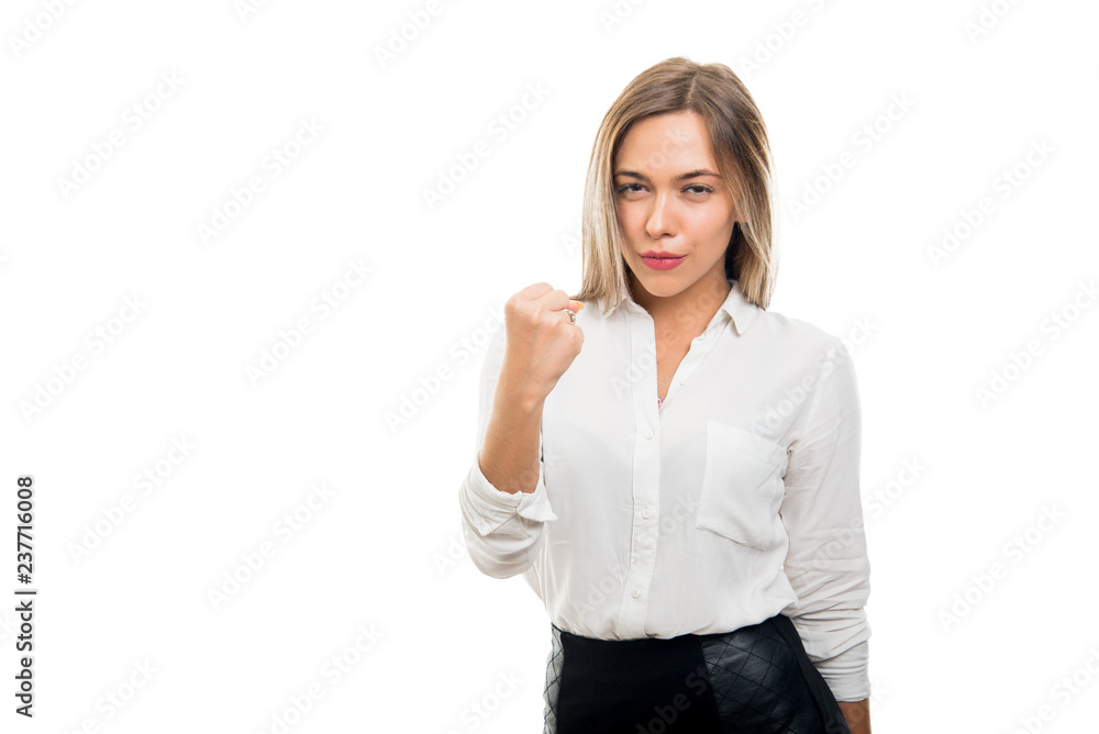 Young pretty business woman showing fist like fighting Young pretty business woman showing fist like fighting