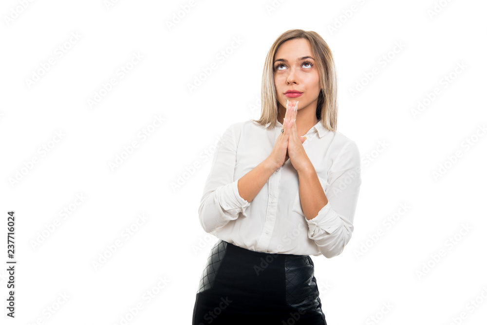 Young pretty business woman making prayer gesture Young pretty business woman making prayer gesture