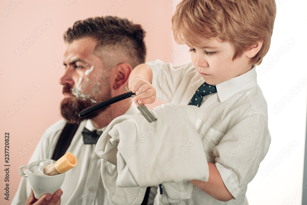Hairdresser makes hairstyle a man with a beard. Sandalwood shaving cream. Barber scissors and straight razor. Barbershop vintage. Bearded stylish barber shop client. Hair salon and barber vintage Hairdresser makes hairstyle a man with a beard. Sandalwood shaving cream. Barber scissors and straight razor. Barbershop vintage. Bearded stylish barber shop client. Hair salon and barber vintage