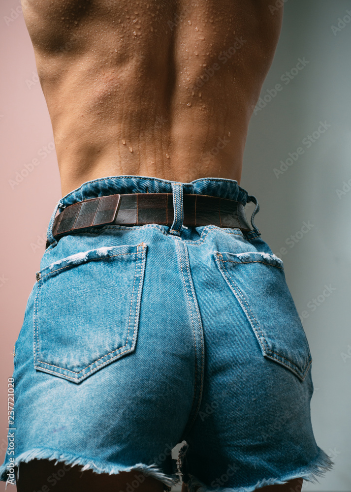 Jeans, denim shorts. Sexy female ass buttocks. Blue jeans on beautiful  female butt. Sexy girl with big bum. Fit buttocks. Sensual attractive young  woman ass. Female back and buttocks. foto de Stock