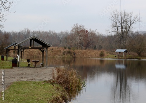 A cloudy late autumn day at the lake in the park. © Al