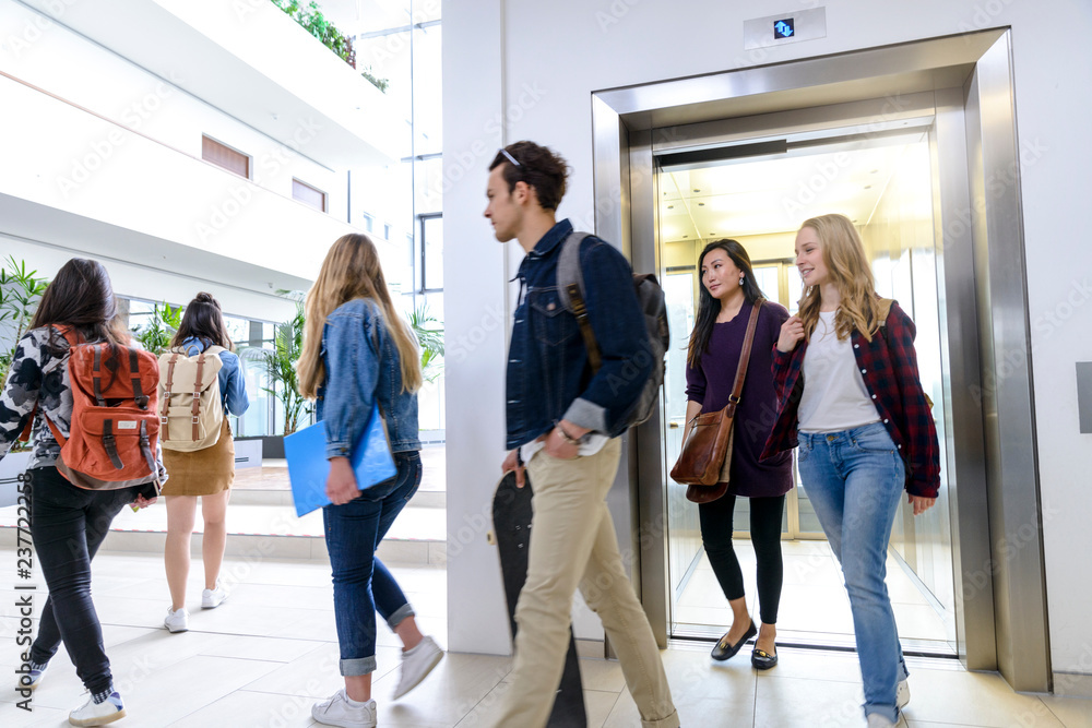 University students exiting elevator in campus University students exiting elevator in campus