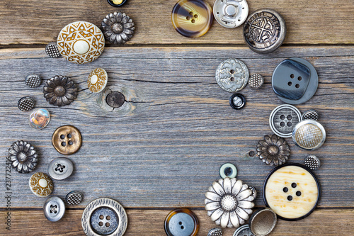 several old buttons on the vintage table surface