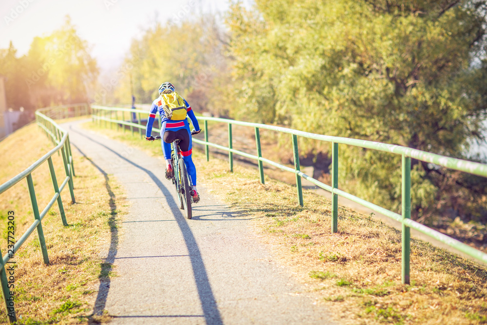 Professional road man bicycle racer in action. Professional road man bicycle racer in action.