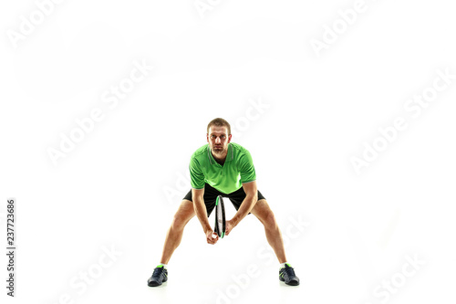 Fototapeta Naklejka Na Ścianę i Meble -  The one caucasian man playing tennis isolated on white background. Studio shot of fit young player at studio in motion or movement during sport game..