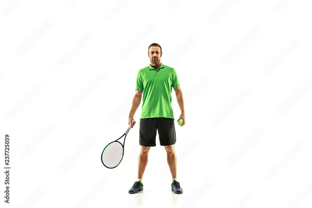 The one caucasian man playing tennis isolated on white background. Studio shot of fit young player at studio in motion or movement during sport game.. The one caucasian man playing tennis isolated on white background. Studio shot of fit young player at studio in motion or movement during sport game..