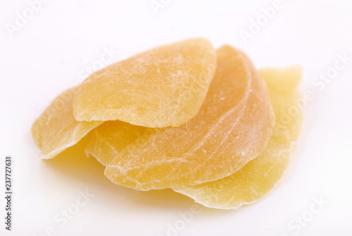 Candied fruit mango in sugar on a white background.
