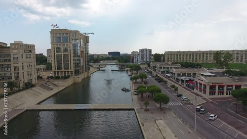 Council of Montpellier administrative building in front of river Lez aerial drone view. photo