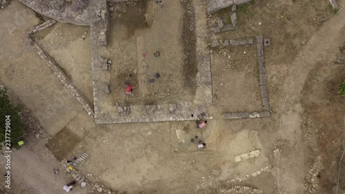 Scientists working on an archaeological site oppidum Murviel-les-Montpellier. Aerial drone view ancient hill town photo