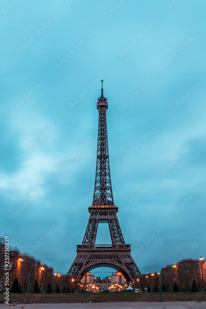Eiffel Tower in the morning against a cloudy sky in winter
