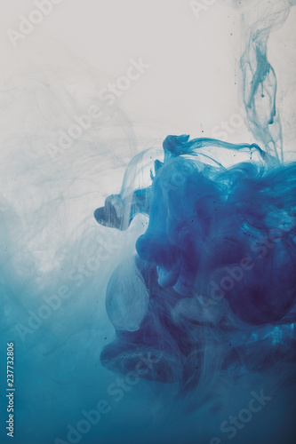 abstract artistic background with blue swirls of paint