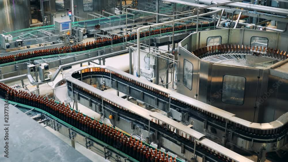 Brewery equipment working in a factory facility. Brewery equipment working in a factory facility.