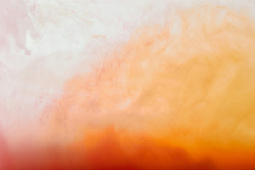 abstract texture with white and orange swirls of paint