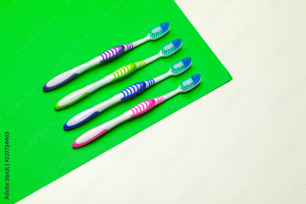 toothbrush on green background, dental care concept toothbrush on green background, dental care concept