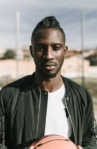 Portrait of young man standing outdoors
