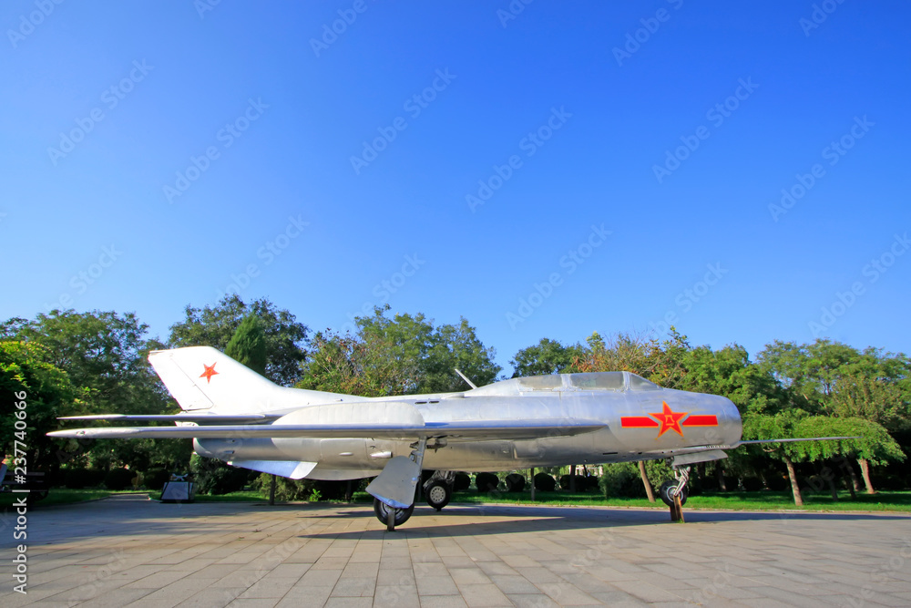Chinese air retired fighter jets in a park Chinese air retired fighter jets in a park