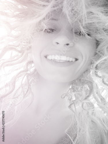 Fototapeta Naklejka Na Ścianę i Meble -  portrait of a happy laughing blonde girl