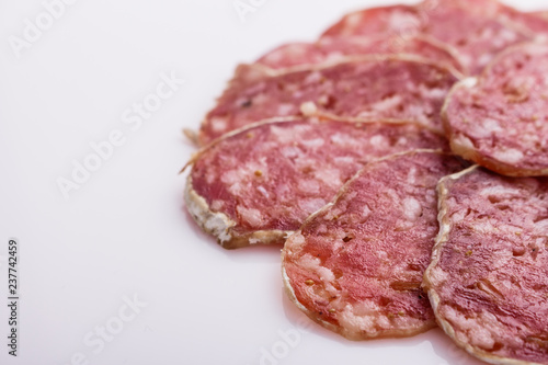Saucisson sec delicious french salami on a white background