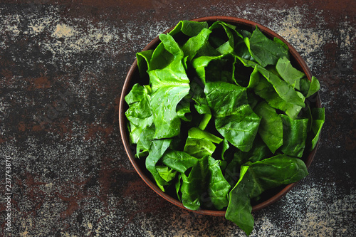 Bowl with chopped spinach. Flat lay.