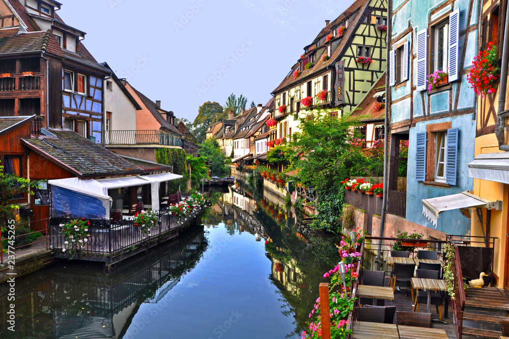 medieval houses on the banks of river in colmar city france.