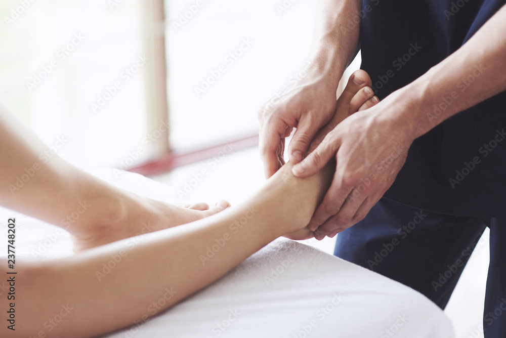 Woman's foot massage at the spa, relaxation rest. Woman's foot massage at the spa, relaxation rest.