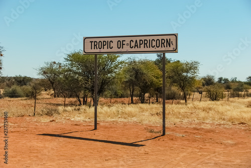 Rehoboth, Namibia, 2 August 2018: Sign of Tropic of Capricorn (or the Southern Tropic) which is the circle of latitude that contains the subsolar point on the December (or southern) solstice photo