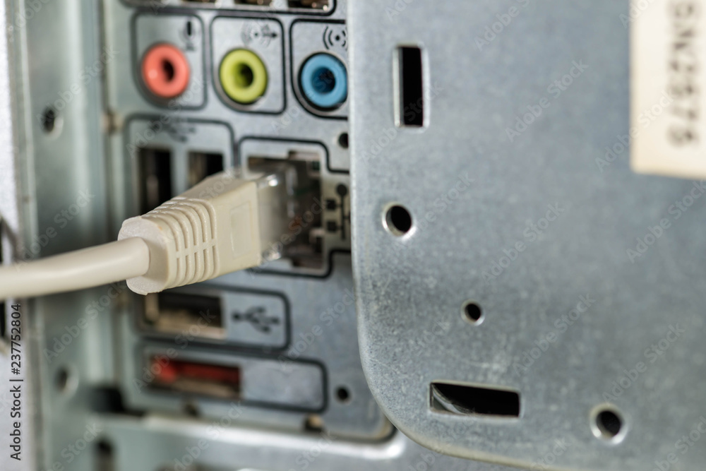 Connected grey internet switch on personal computer close up macro shot. Connected grey internet switch on personal computer close up macro shot.