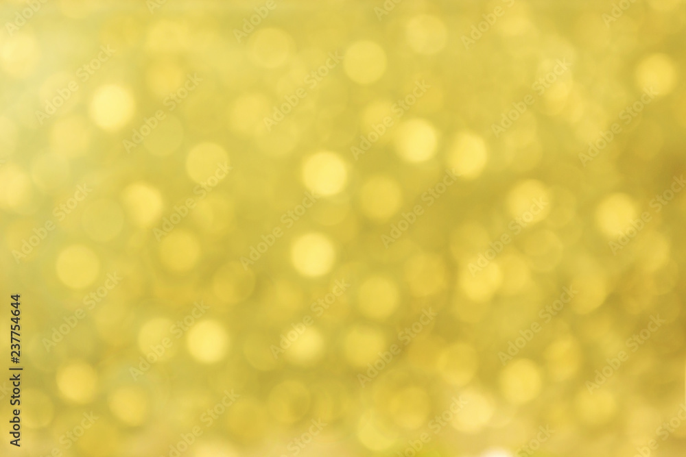 Obraz premium Lights on gold with star bokeh background.