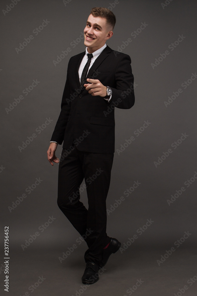 young man in elegant suit posing. Business style. Male beauty, fashion. Hairstyle. young man in elegant suit posing. Business style. Male beauty, fashion. Hairstyle.