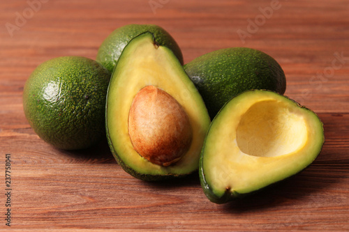  Avocado fruit on wooden table top view.