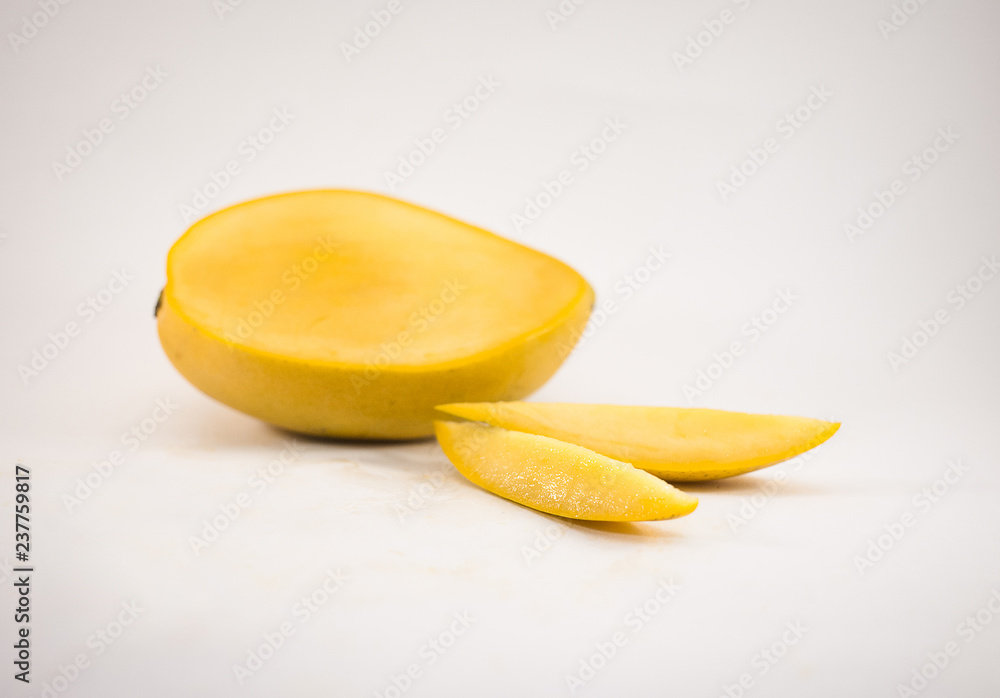 Yellow mango and mango slices isolated white background Yellow mango and mango slices isolated white background