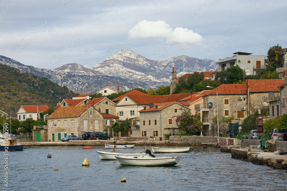 Small seaside Mediterranean village on cloudy autumn day. Montenegro, Adriatic Sea, Bay of Kotor, Lepetane village