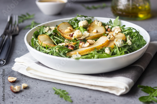 Arugula, gorgonzola cheese, caramelized pear and nut salad. Healthy food. Light breakfast, lunch or dinner. 
