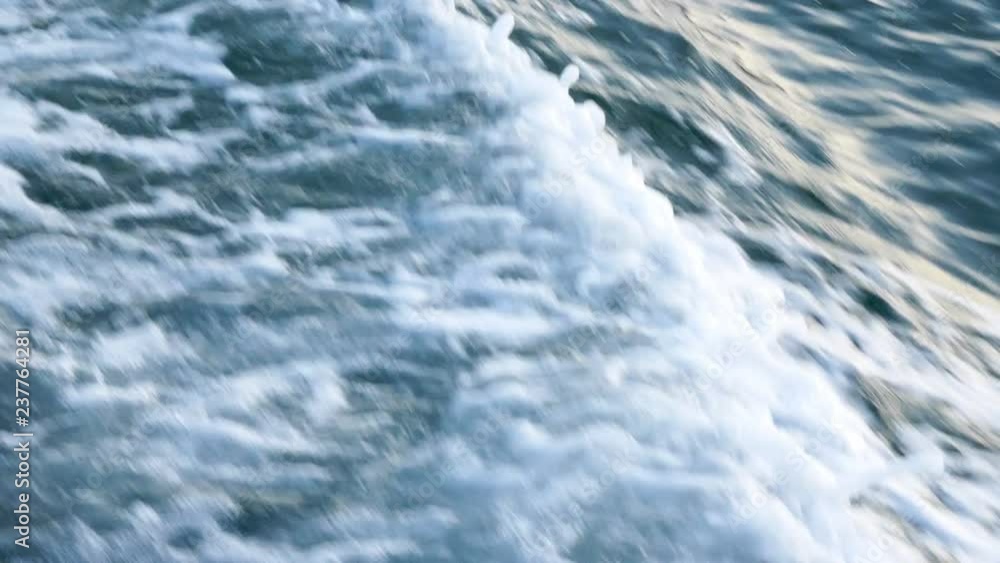 Sea or ocean waves and foam after motor boat or yacht Sea or ocean waves and foam after motor boat or yacht