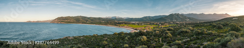 Panoramic view of Lozari beach and distant mountains in Corsica