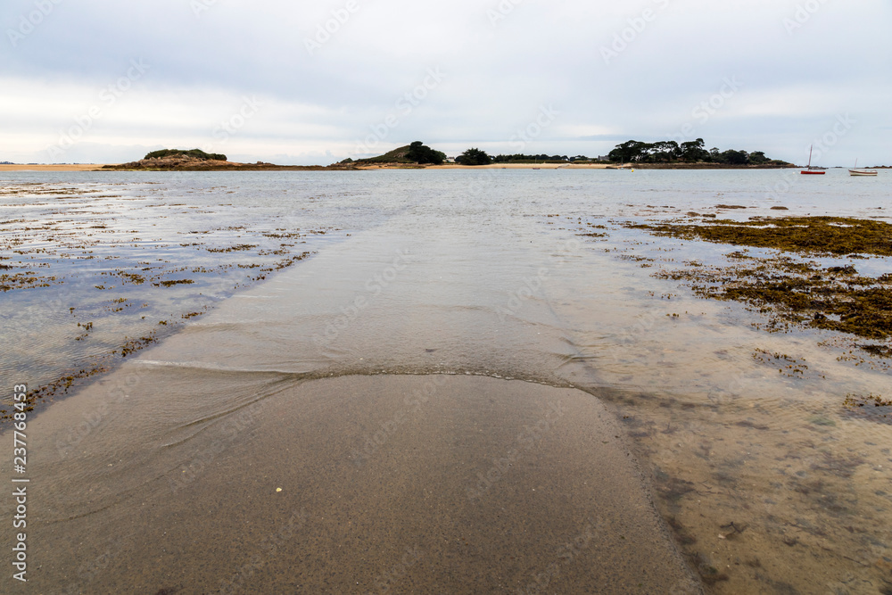 Carantec, France. The submersible passage to Ile Callot, a tidal island only accesible al low tide in the coast of Brittany (Bretagne)